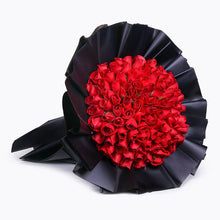 One hundred and one red roses massed into a large round hand-tied bouquet