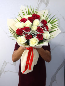 Close-up of red and white rose bouquet, flower delivery Dubai
