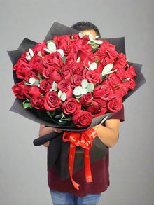 51 red roses round bouquet with eucalyptus, roses Dubai