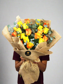 Jute wrapping yellow and orange rose bouquet, roses Dubai