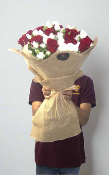 Red roses with white spray roses, jute wrapping, roses Dubai