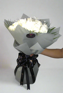 White roses in grey wrapping, roses Dubai