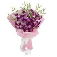 Purple flower bouquet in pink wrapping, flower delivery Dubai