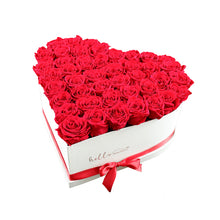 Red rose arrangement in heart shaped box, romantic flowers Dubai