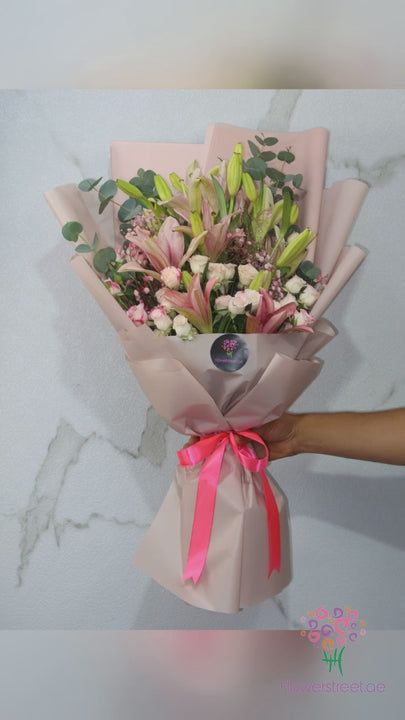 Pink lily and double pink spray rose bouquet