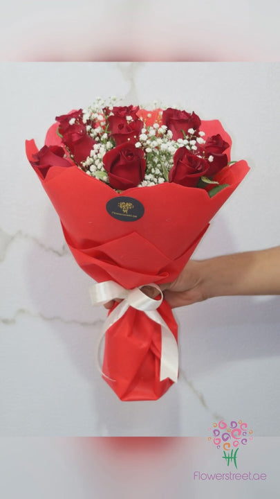 Ten red roses with baby's breath bouquet